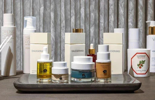 A collection of Dalegard and Irene Forte skincare products, displayed in elegant packaging, showcasing luxurious formulas.